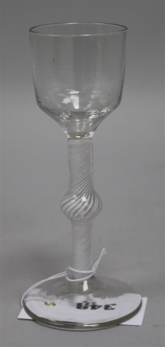 A wine glass, c.1765, with funnel bowl, knopped opaque twist stem, 6.5in.